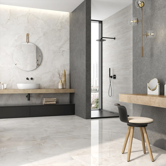A bathroom tiled in Onice Bianco polished porcelain wall and floor tiles